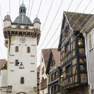 Clock tower and artfully painted half-timbered houses Clock tower and artfully painted half-timbered houses
