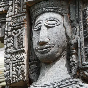 Close up shot of stone statue of a woman with a smiling face Close up shot of stone statue of a woman with a smiling face
