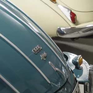 Close-up of two Audi classic cars in different colours with chrome details