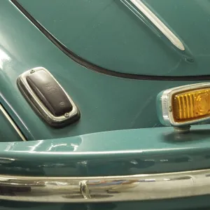 Close-up of a blue bumper of a classic car