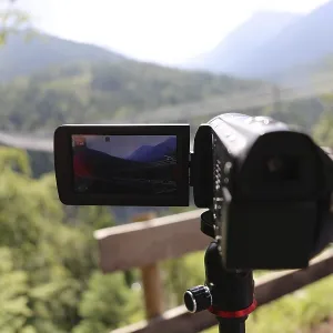Close-up of a camcorder during video recording in nature Close-up of a camcorder during video recording in nature