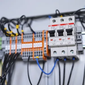 Close-up of circuit-breakers and cables in an electrical system