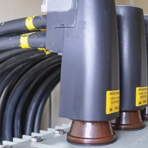 Close-up of plug connections and cables on a transformer