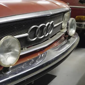 Close-up of a red Audi classic car with distinctive radiator grille and headlights