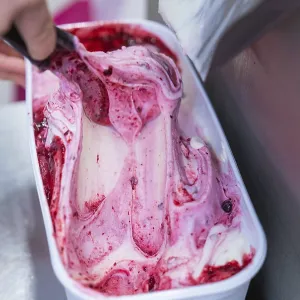 Close-up of red and white ice cream in the container
