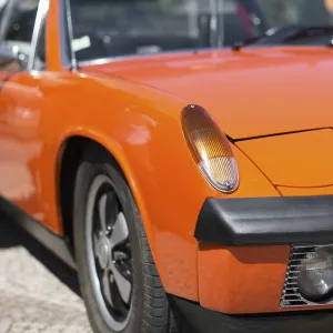 Close-up view of orange retro car headlight Close-up view of orange retro car headlight