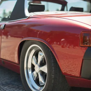 Close-up view of red retro car headlight