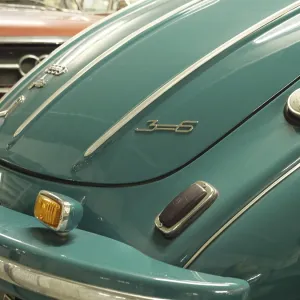 Close-up of a vintage car back in blue with chrome-plated bumper and details