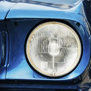 Closeup on the front light of an old retro car