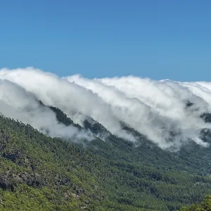 Clouds cross the mountains from side to side on the island of La Palma Clouds cross the mountains from side to side on the island of La Palma
