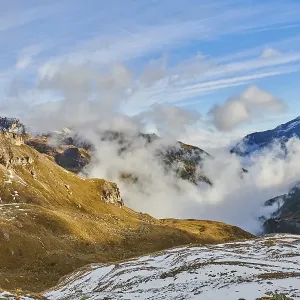 Clouds lying in the valley between Mountains at Hochalpenstrasse Clouds lying in the valley between Mountains at Hochalpenstrasse