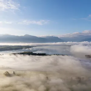 Cloudy landscape with Forggensee and mountain panorama at dawn