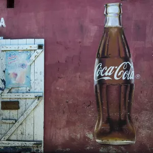 Coca Cola advertising and the open door of a restaurant Coca Cola advertising and the open door of a restaurant
