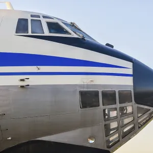 Cockpit of a large vintage civilian plane with blue stripes isolated closeup