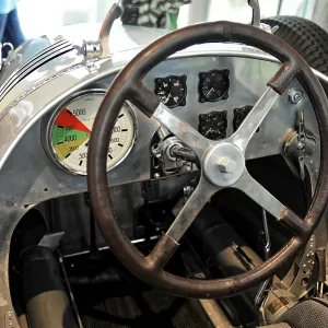 Cockpit view of a vintage car with steering wheel and instrument panel in retro design Cockpit view of a vintage car with steering wheel and instrument panel in retro design