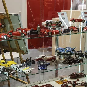 Collector's showcase with models of historic sports cars racing cars