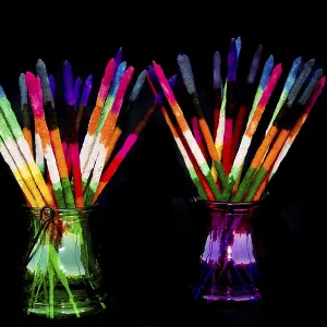 Colored and fragrance handmade incense sticks on black background