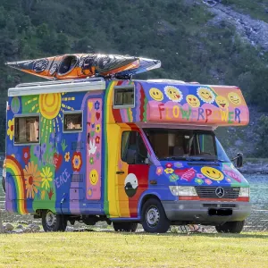 Colorful camper van, campsite Geiranger at the Geirangerfjord Colorful camper van, campsite Geiranger at the Geirangerfjord