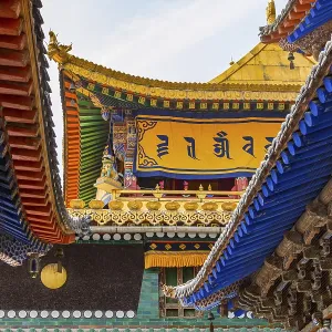 Colorful roofs with beams and ornaments and spectacular decorations at a temple in Kumbum Jampaling Monastery