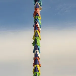 Colorful silk tied to a rope in a Buddhist temple