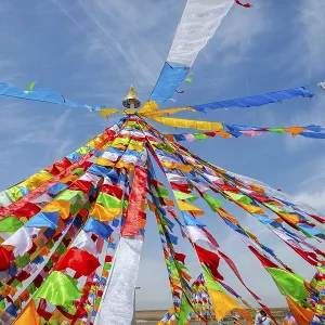 Colorful tibetan buddhist praying flags in the wind next to Chaqia salt lake Colorful tibetan buddhist praying flags in the wind next to Chaqia salt lake