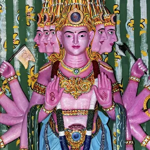 Colourful depiction of a multi-headed deity with detailed decorations Colourful depiction of a multi-headed deity with detailed decorations