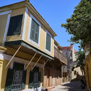 Colourful house facades with shutters in a historic alley