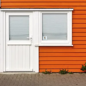 Colourful lobster shack, orange wooden facade with door and window Colourful lobster shack, orange wooden facade with door and window