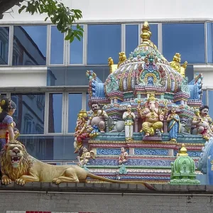 Colourful temple roof with figures and a lion Colourful temple roof with figures and a lion