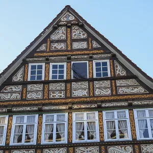 Colourfully painted and carved facade of a half-timbered house Colourfully painted and carved facade of a half-timbered house