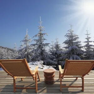 Comfortable wooden chairs and a small round table invite tourists to relax Comfortable wooden chairs and a small round table invite tourists to relax