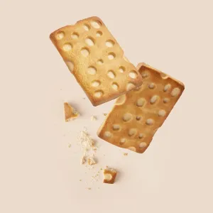Cookies with crumbs on a beige background