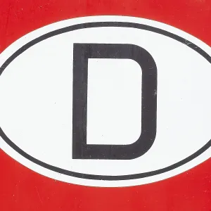 Country code D for Germany on a red vintage car Country code D for Germany on a red vintage car