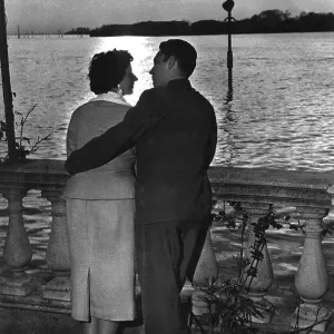 Couple in love at sunset by the sea Couple in love at sunset by the sea