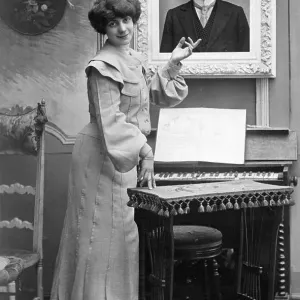 Couple, a woman points to the photo of her lover Couple, a woman points to the photo of her lover