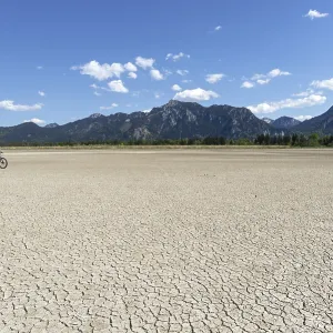 Cracked, dried out ground, waterless Forggensee in spring Cracked, dried out ground, waterless Forggensee in spring