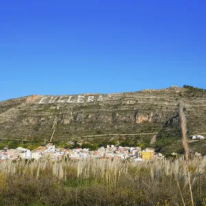 Cullera mountain with white sign writted on Valencia of Spain