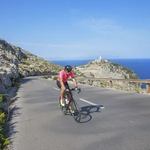 Cyclists on mountain road by Cap de Formentor