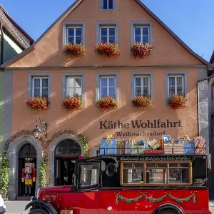 Decorated vintage bus in front of the house of Kathe Wohlfahrt Christmas Village