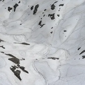 Detail, old snow fields in a rock basin