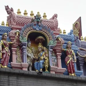 Detailed figures in bright colors on temple roof Detailed figures in bright colors on temple roof