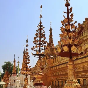 Detailed golden decorations of the temple under a clear sky in Nyaung-U Detailed golden decorations of the temple under a clear sky in Nyaung-U