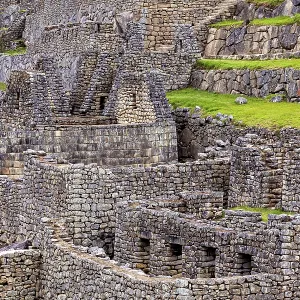 Detailed Inca stone structures and green terraces near Machu Picchu