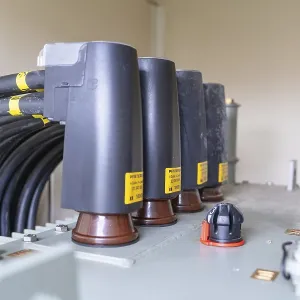 Detailed view of cable connections and a transformer in industry