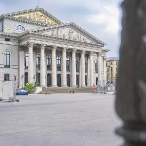 Detailed side view of a magnificent building with columns in Munich
