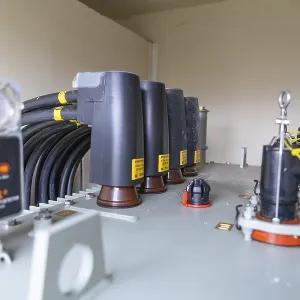 Detailed view of a transformer with several cable connections