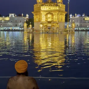 Devout Sikh bathing in an artificial lake