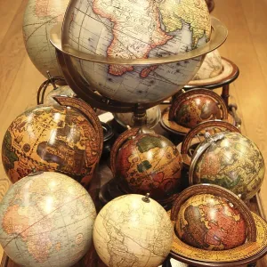 Many different world globes for sale in an antiquarian shop
