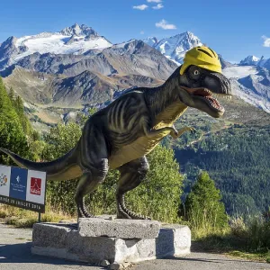 Dinosaur sculpture a barrage de Emosson in front of snow covered mountains