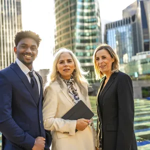 Diverse business team of professionals standing united and smiling